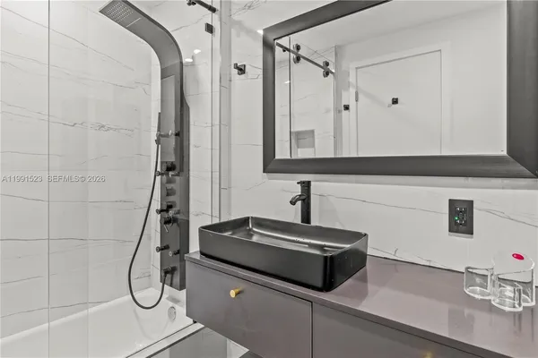 a bathroom with a sink and a mirror
