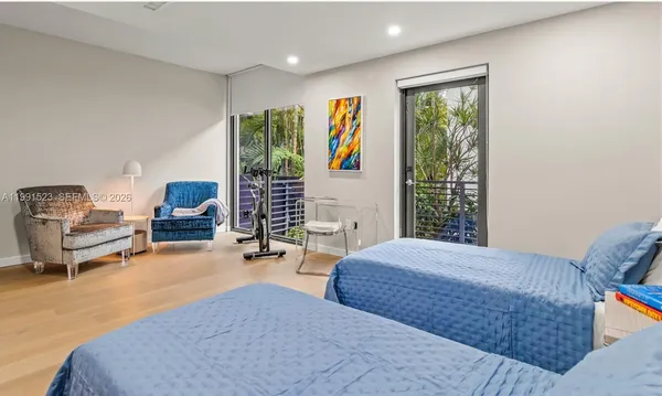 a bedroom with furniture and a window