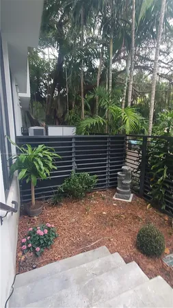 a backyard of a house with lots of green space