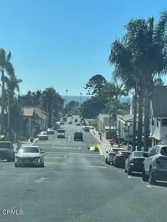 a view of a street with cars
