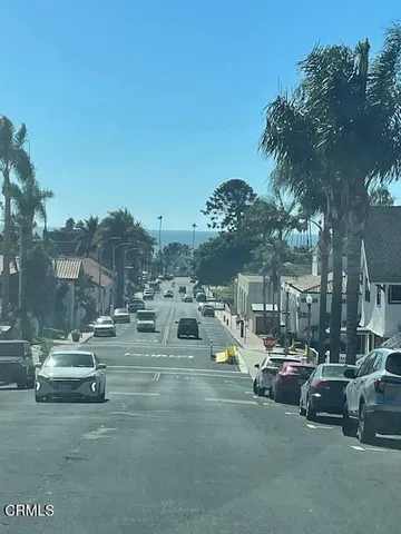 a view of a street with cars