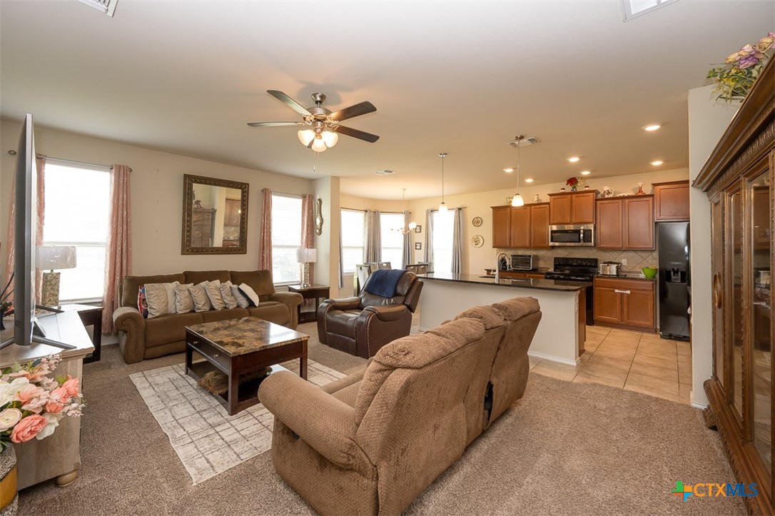 2511 Pintail Loop Copperas Cove, TX 76522 - Photo 5 of 26 a living room with couches and kitchen view with wooden floor