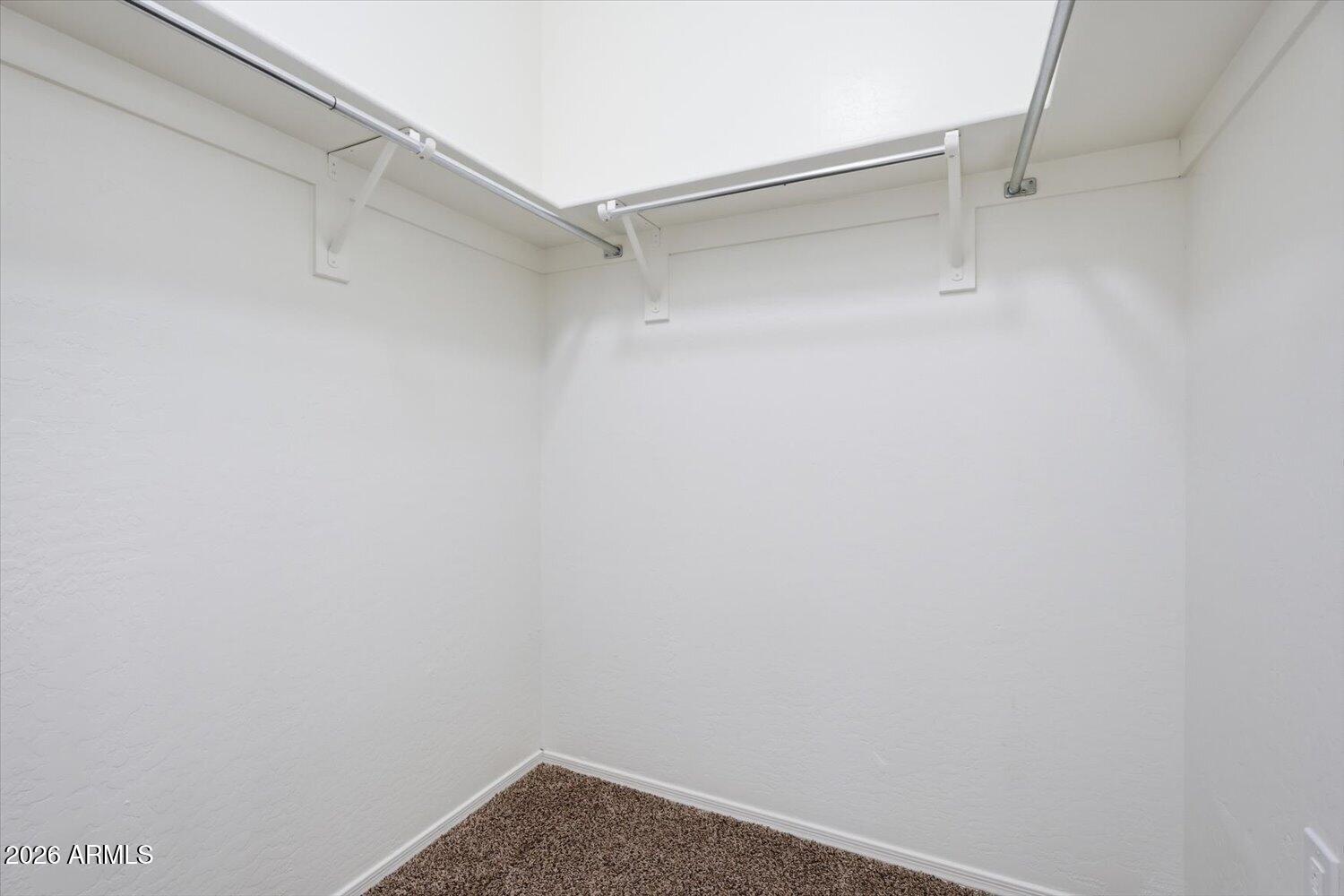 2565 South Signal Butte Road, Unit 23 Mesa, AZ 85209 - Photo 18 of 29 a view of an empty walk in closet