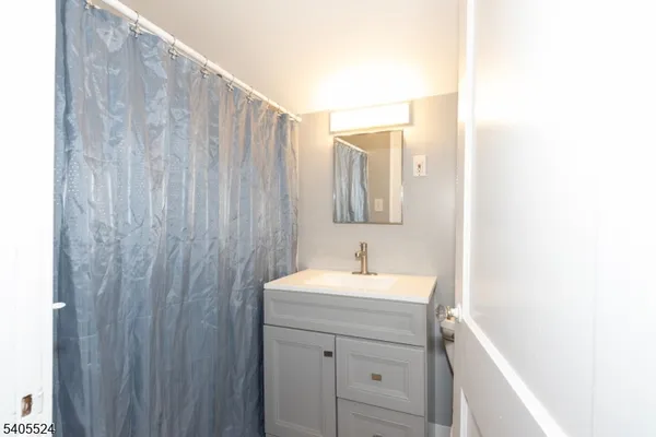 a bathroom with a sink a vanity and a mirror