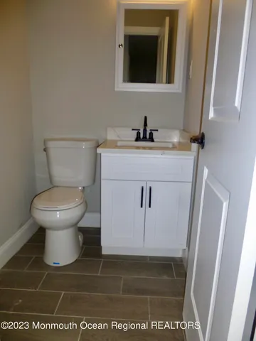 a bathroom with a toilet and a sink