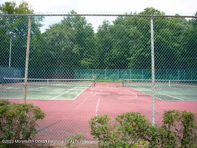 a view of yard with swimming pool and green space