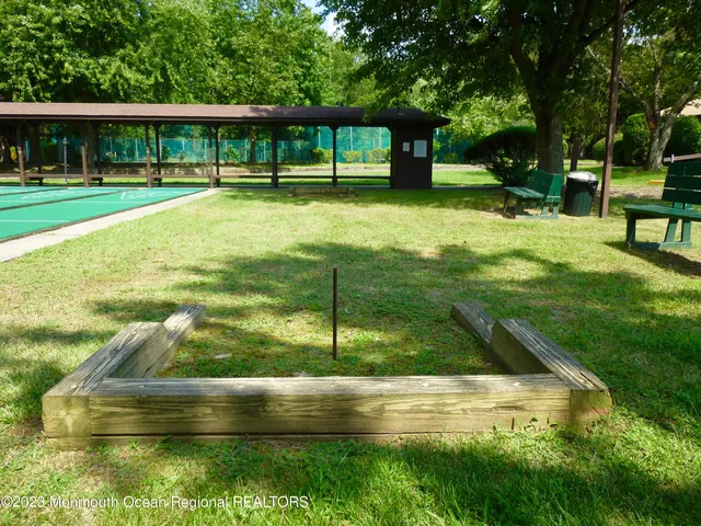 a aerial view of a house with a yard and sitting area