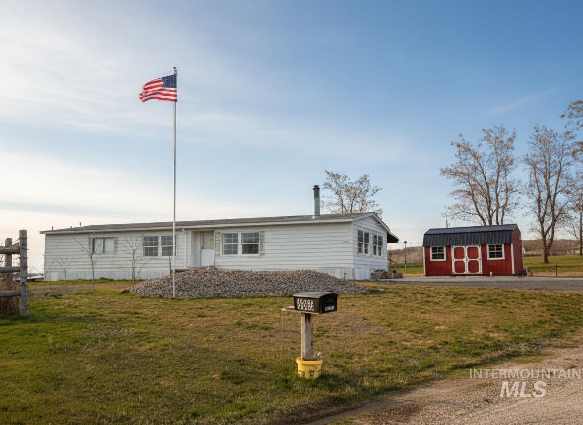 3065 Center Avenue Payette, ID 83661 - Photo 3 of 3 View of front of home with a front lawn and a storage unit