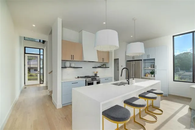 a kitchen with granite countertop a sink cabinets and window
