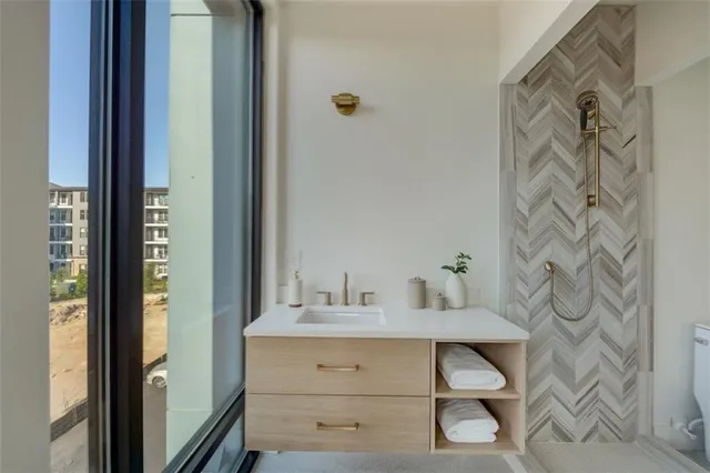 a bathroom with a tub and shower
