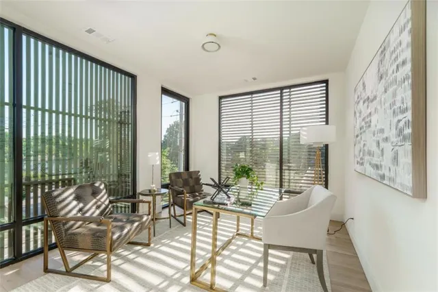 a bathroom with a sink toilet a mirror and shower