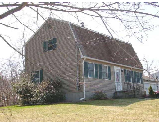 79 Kimball Road Amesbury, MA 01913 - Photo 1 of 1 a brick house that has a tree in front of it