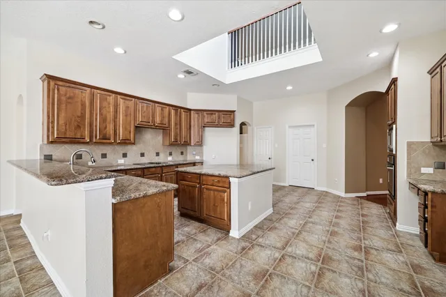 a bathroom with a sink mirror and toilet