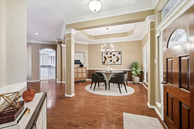 a view of a dining room with furniture and wooden floor