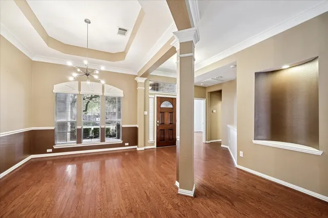a view of a room with wooden floor and outdoor space