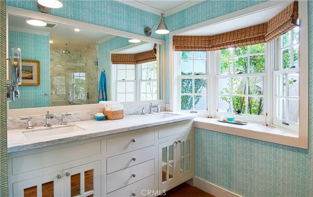 a bathroom with a sink and a window