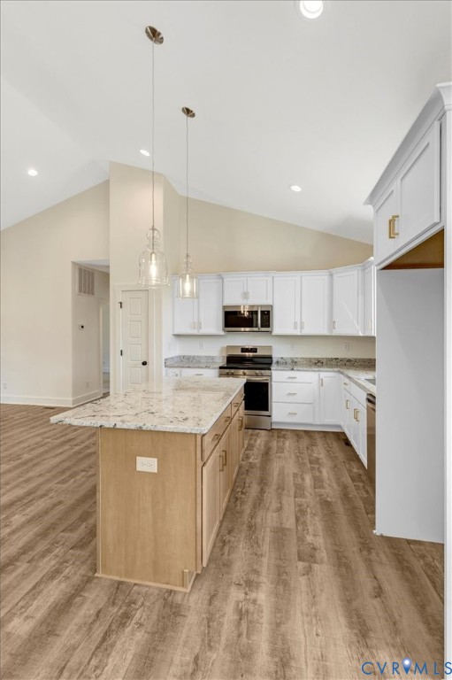 4752 Country Club Road La Crosse, VA 23950 - Photo 19 of 35 a large kitchen with kitchen island a sink stainless steel appliances and cabinets