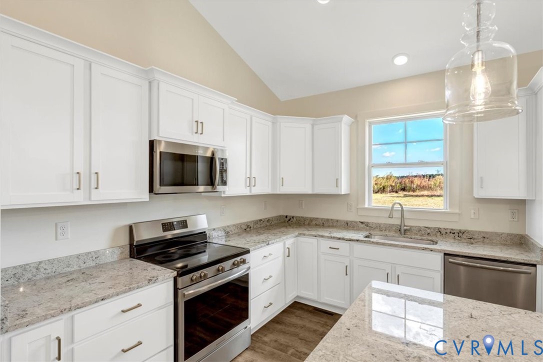 4752 Country Club Road La Crosse, VA 23950 - Photo 2 of 35 a kitchen with stainless steel appliances granite countertop white cabinets granite counter tops and a window