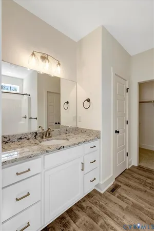 a bathroom with a glass shower door