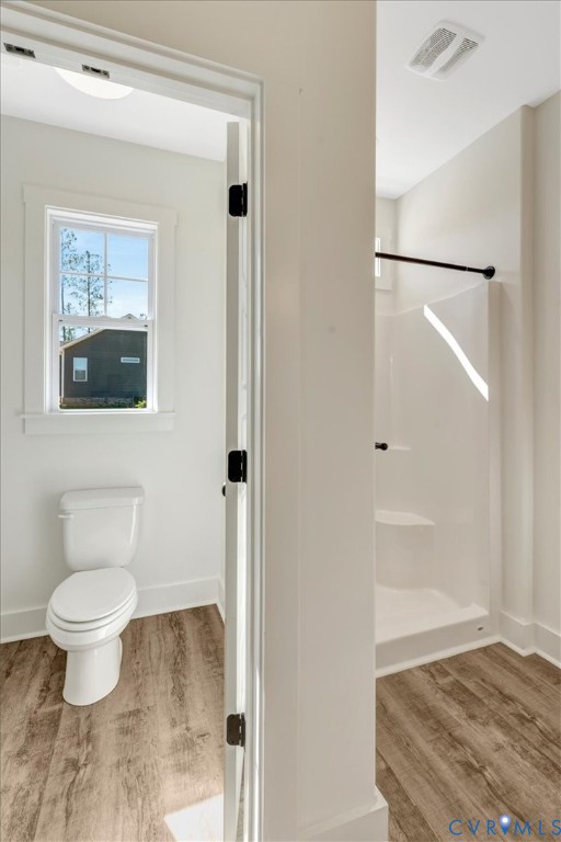 4752 Country Club Road La Crosse, VA 23950 - Photo 26 of 35 a bathroom with a toilet and a shower