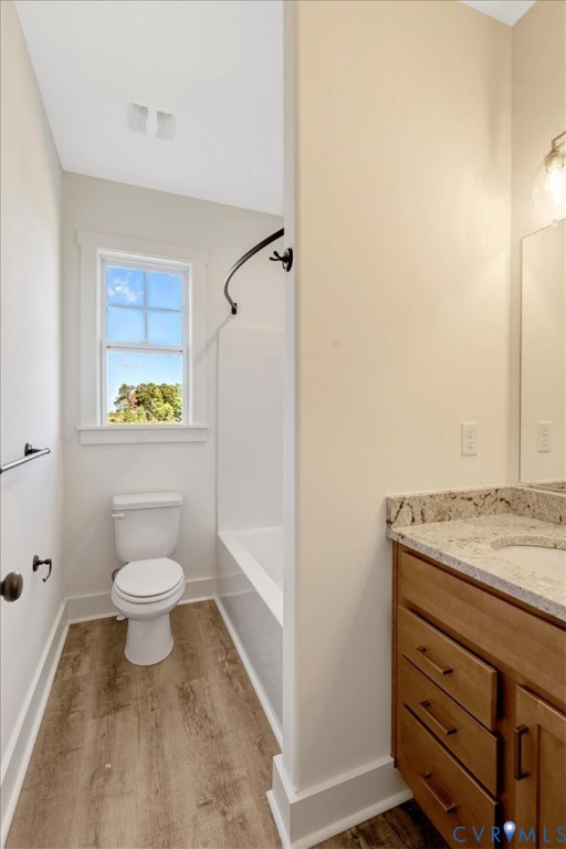 4752 Country Club Road La Crosse, VA 23950 - Photo 29 of 35 a bathroom with a sink a toilet and a window
