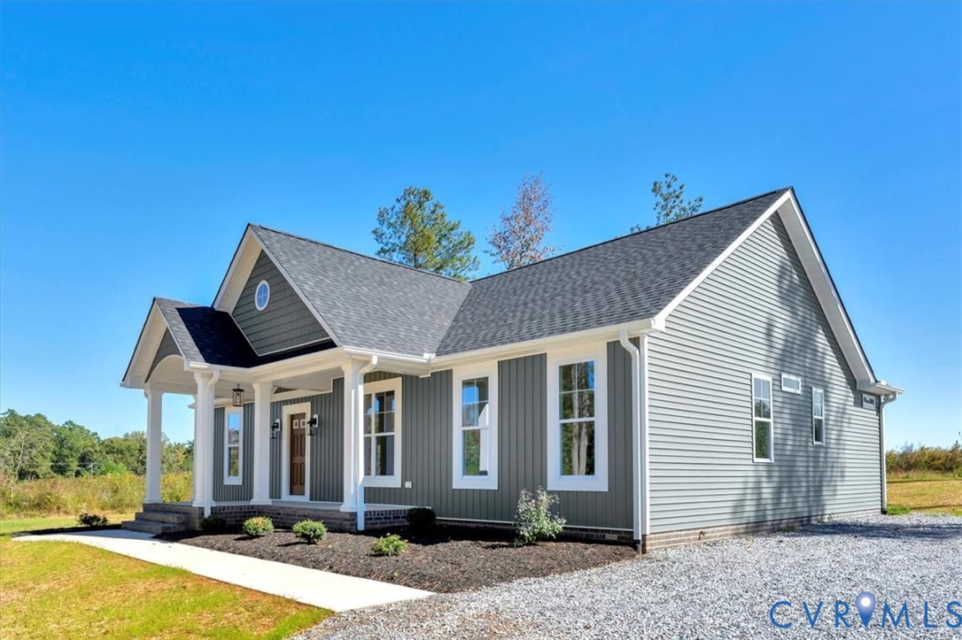 4752 Country Club Road La Crosse, VA 23950 - Photo 4 of 35 a front view of a house with a yard