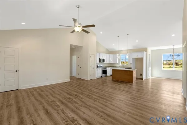 a view of kitchen with refrigerator and window