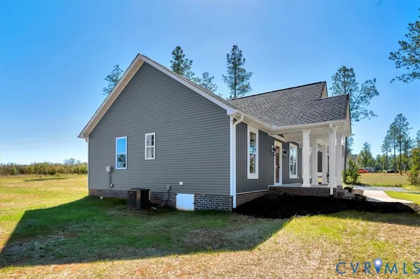 a view of a house with swimming pool and sitting area
