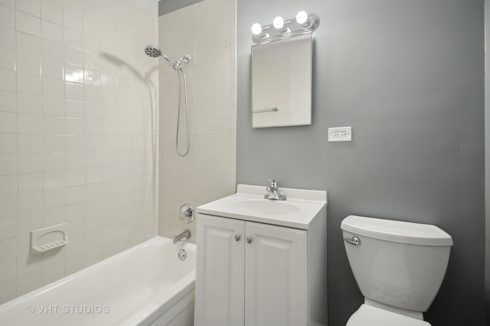 412 Cahill Road Streamwood, IL 60107 - Photo 12 of 16 a bathroom with a toilet sink and mirror