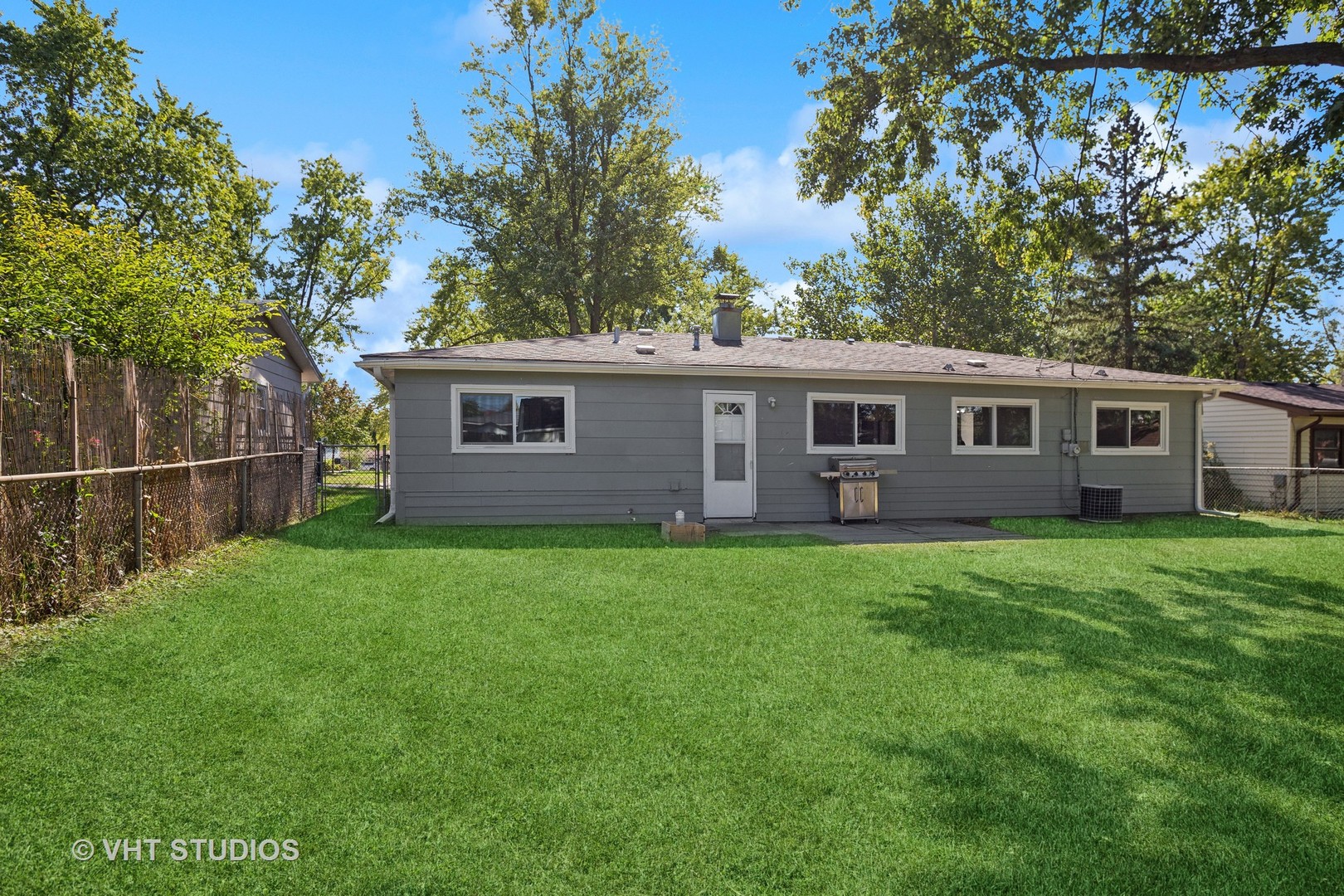 412 Cahill Road Streamwood, IL 60107 - Photo 15 of 16 a view of a house with backyard and garden