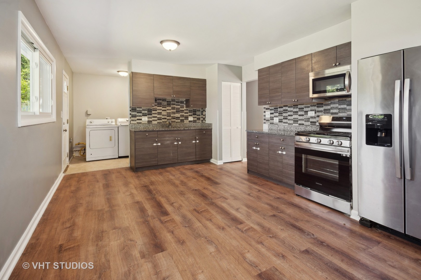 412 Cahill Road Streamwood, IL 60107 - Photo 4 of 16 a large kitchen with a stove sink and refrigerator