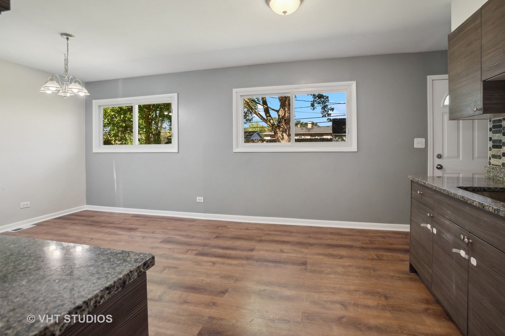 412 Cahill Road Streamwood, IL 60107 - Photo 7 of 16 an empty room with wooden floor and window