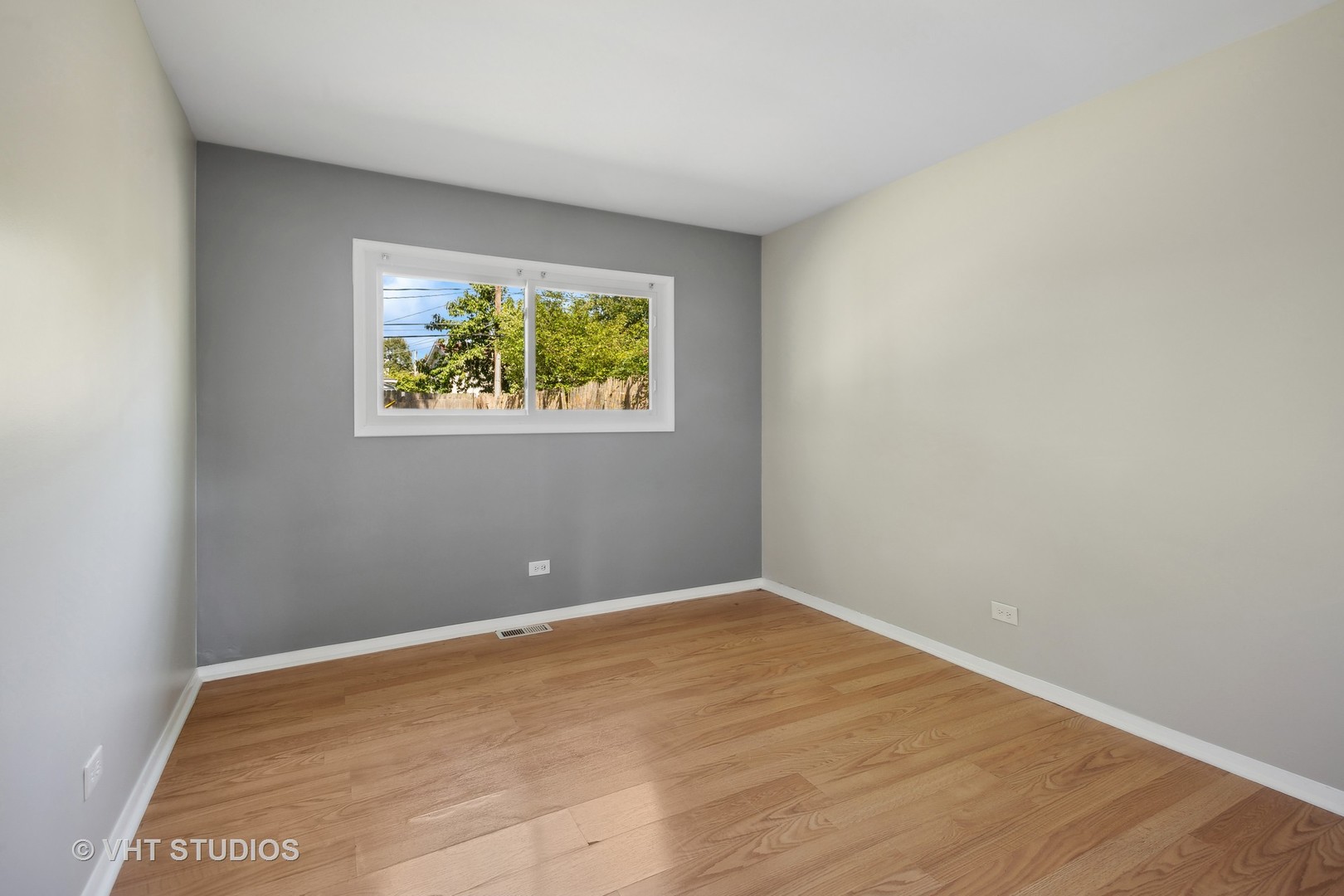 412 Cahill Road Streamwood, IL 60107 - Photo 8 of 16 a view of an empty room with a window