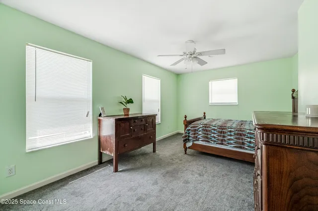 a bed room with a bed and a window