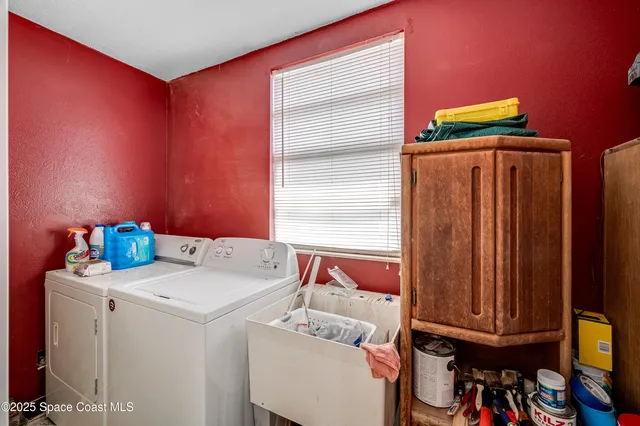 a utility room with dryer and washer