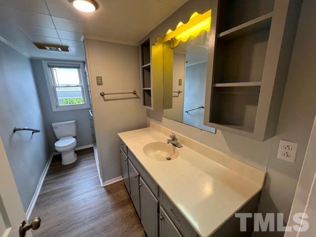 301 North 16th Street Erwin, NC 28339 - Photo 13 of 21 a bathroom with a sink a toilet and shower