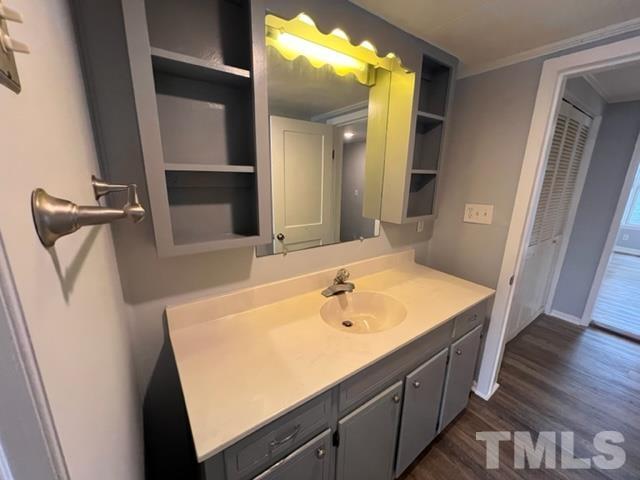 301 North 16th Street Erwin, NC 28339 - Photo 14 of 21 a bathroom with a sink and a large mirror