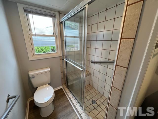 301 North 16th Street Erwin, NC 28339 - Photo 15 of 21 a bathroom with a toilet and a shower