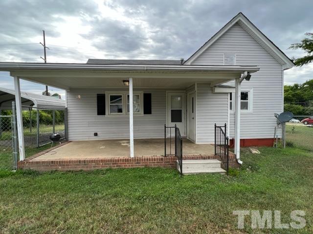301 North 16th Street Erwin, NC 28339 - Photo 18 of 21 a view of a house with backyard and a tree