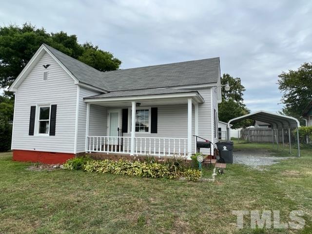 301 North 16th Street Erwin, NC 28339 - Photo 2 of 21 a front view of a house with garden