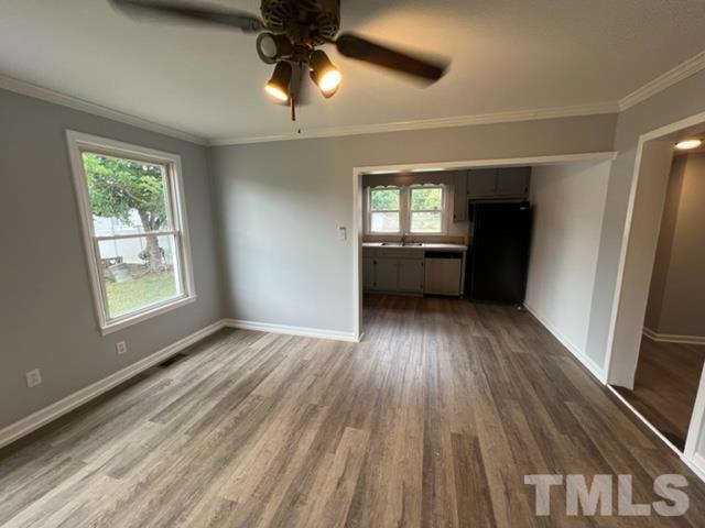 301 North 16th Street Erwin, NC 28339 - Photo 5 of 21 wooden floor in an empty room with a window
