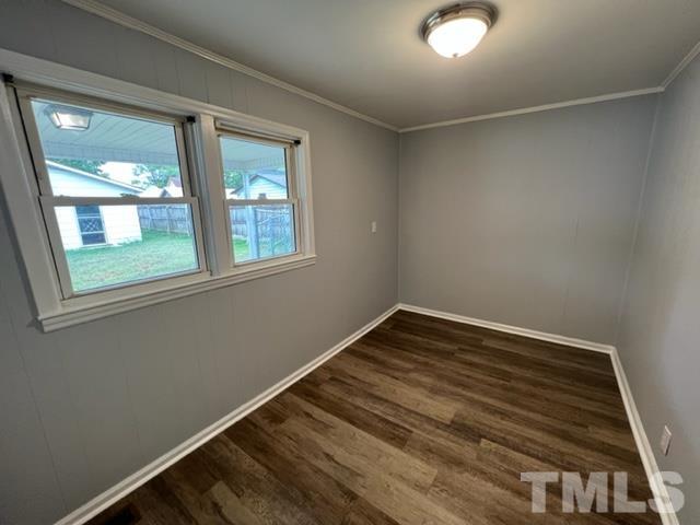 301 North 16th Street Erwin, NC 28339 - Photo 8 of 21 a view of a room with wooden floor and windows
