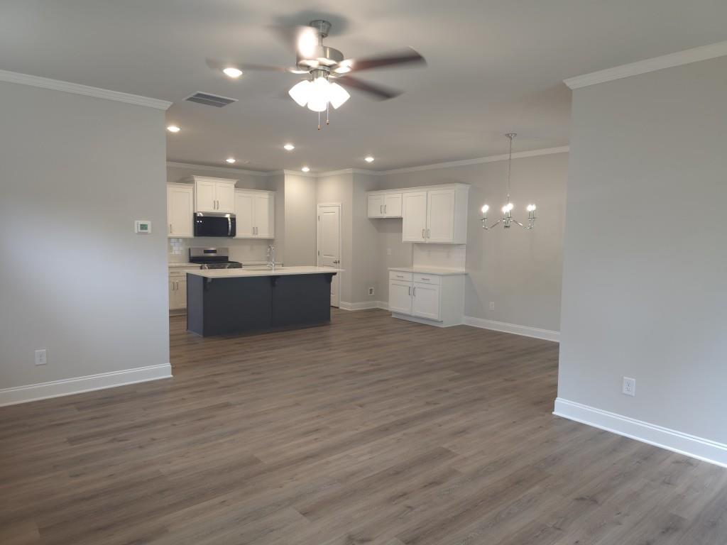 4240 Cavalier Way Duluth, GA 30097 - Photo 7 of 46 a view of a kitchen with a sink and a stove top oven