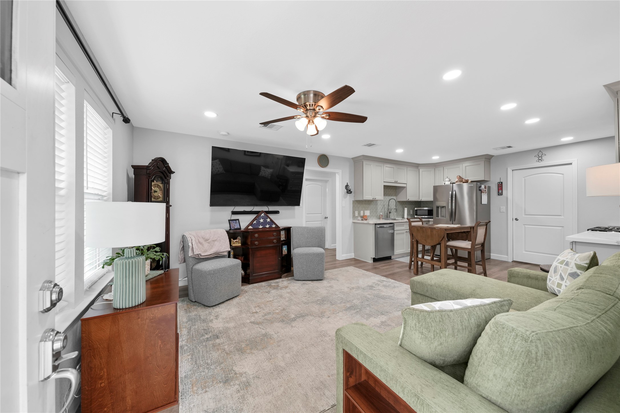 3027 Poppy Street Needville, TX 77461 - Photo 28 of 41 a living room with furniture and a flat screen tv