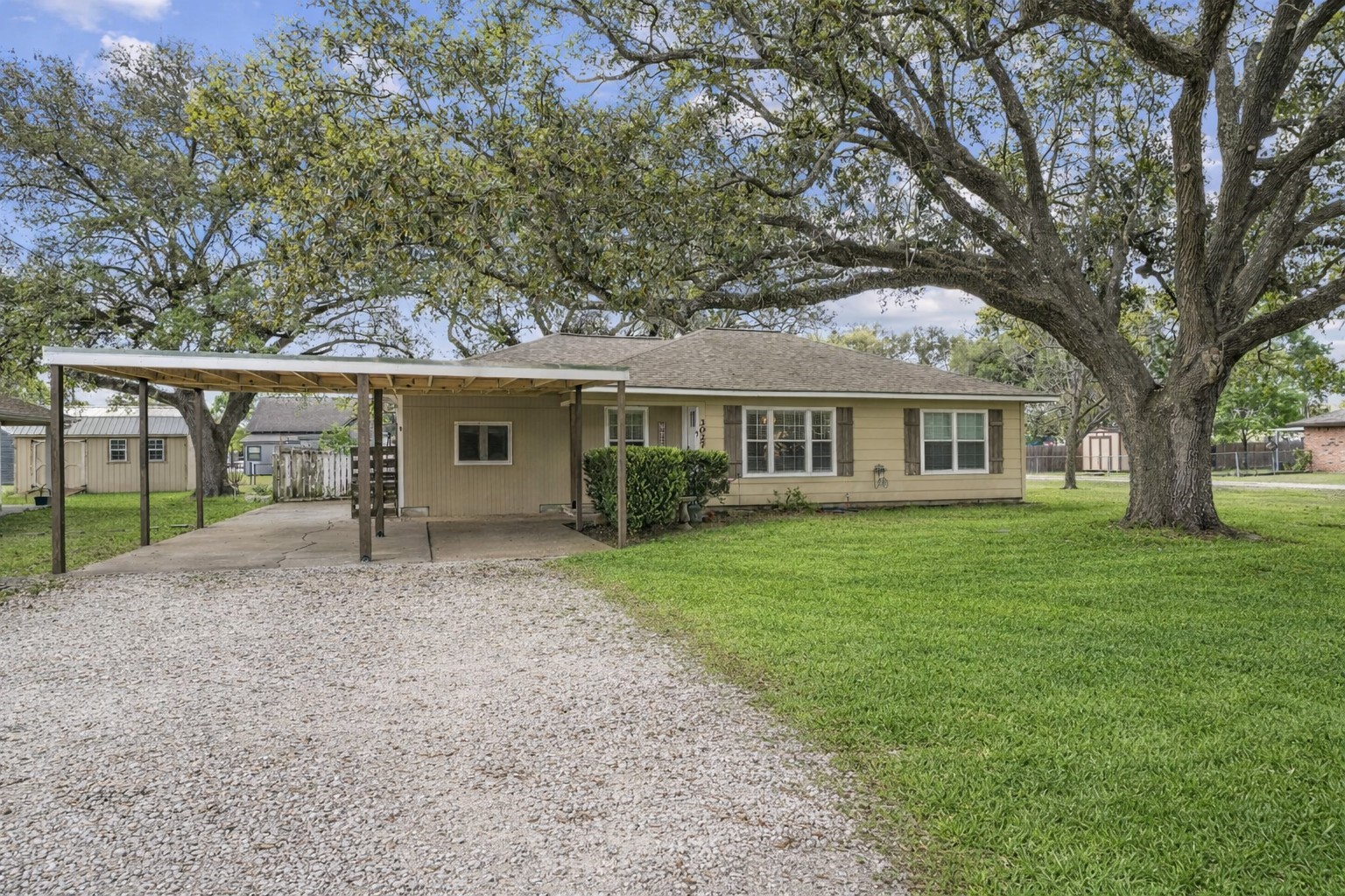 3027 Poppy Street Needville, TX 77461 - Photo 3 of 41 front view of a house with a garden