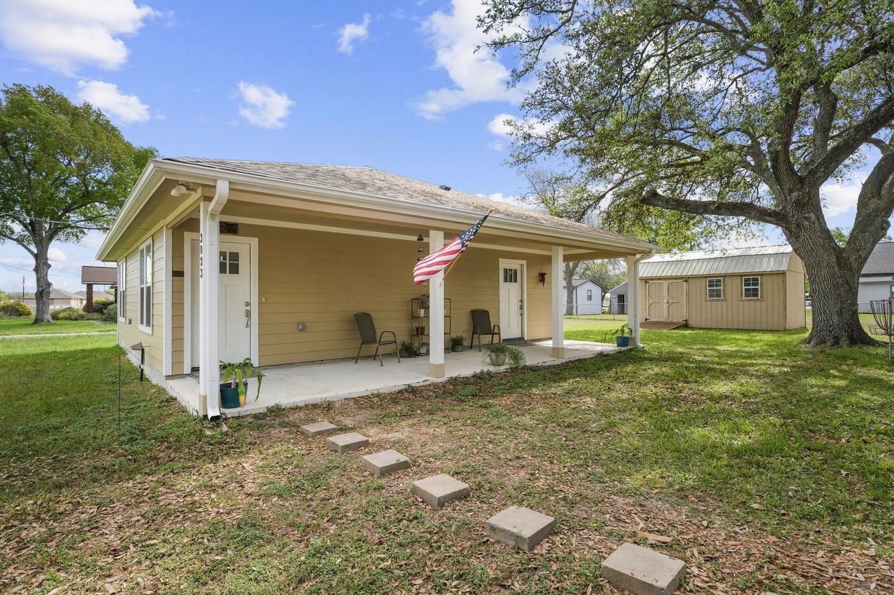 3027 Poppy Street Needville, TX 77461 - Photo 5 of 41 a front view of a house with a yard