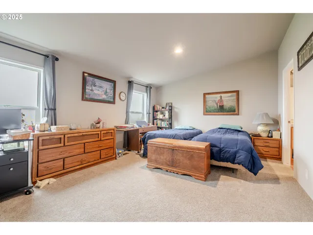 a bedroom with furniture and window