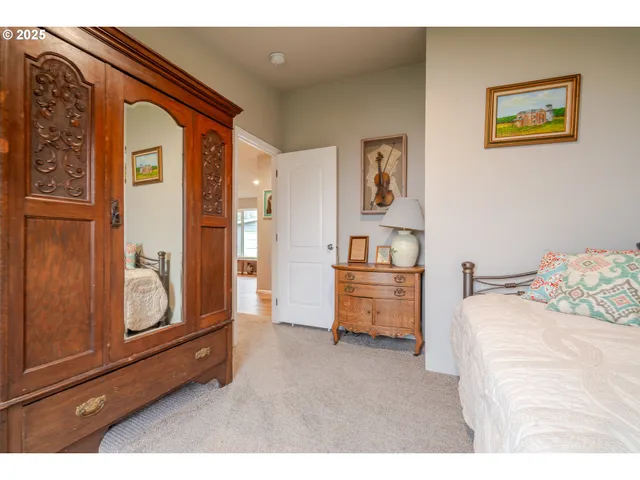 a bedroom with furniture and window