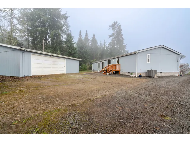 a view of a backyard of the house