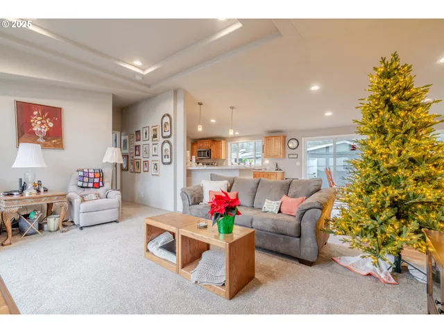 a living room with furniture and flowers
